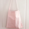Detail of light pink canvas tote bag showing wide shoulder strap and fabric texture - Light Pink