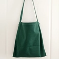 Minimalist dark green canvas tote bag with a simple shoulder strap and white stitching - Dark Green