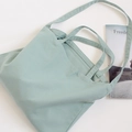 Detail of mint green canvas tote bag showing dual handle stitching and soft texture - Haze Blue