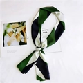 Detail of green, navy, and white diagonal striped silk scarf laid on a white surface - 3 Tri-color Green Black