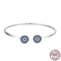 Elegant S925 sterling silver open bangle featuring sparkling blue devil eye zirconias - 925 Silver / Silver-Blue Zirconia