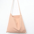 Detailed view of pale pink cotton canvas bag with neat stitching and simple shoulder strap - Flesh Pink