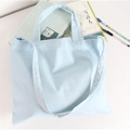 Minimalist light blue canvas tote bag with adjustable shoulder strap for daily use - Light Blue