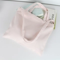 Minimalist light pink canvas tote bag with double handles in a fresh aesthetic style - Light Pink