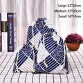 Three-piece set of blue wave pattern cotton linen drawstring bags in various sizes - Blue Square Pattern