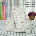 Three-piece set of cotton linen drawstring bags with cat prints in small medium and large - White Cat