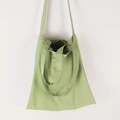 Detail of light green canvas tote bag with dual shoulder straps and hand carry handles - Bean Green