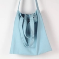Detailed texture of light blue canvas tote bag showing durable fabric and double handles - Light Blue