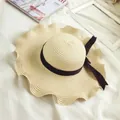 Beige wide brim straw sun hat with black ribbon bow for summer beach vacation - M (56-58cm) / Ruffle Brim Bow Style / Beige