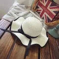 White straw sun hat with wavy brim and black bow detail for summer beach vacation - M (56-58cm) / Wave Brim Bow Style / Cream