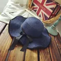 Elegant navy blue straw sun hat with wavy brim and black ribbon bow for summer beach - M (56-58cm) / Wave Brim Bow Style / Navy Blue