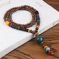 Ethnic style long necklace with dark brown wood beads and a green malachite pendant tassel - Green Agate Round Ball
