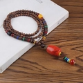 Ethnic style multi-layer brown wood bead necklace with red barrel pendant and colored spacers - Red Resin Cylinder