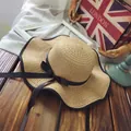Straw sun hat with wide brim, black ribbon bow, and contrast piping for women's beachwear - M (56-58cm) / Wave Brim Bow Style / Light Coffee