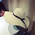 Beige wide brim straw sun hat with black ribbon bow decoration for summer beach - M (56-58cm) / Large Flat Brim Style / Beige
