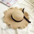 Elegant beige wide brim straw sun hat with black ribbon bow and wavy edge for beach travel - M (56-58cm) / Ruffle Brim Bow Style / Light Coffee