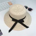 Elegant beige wide brim straw sun hat with a black ribbon bow for women's summer vacation - One Size / Beige