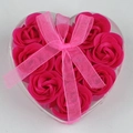Close-up of nine pink soap roses in a heart-shaped gift box with a pink silk ribbon bow - Rose Red