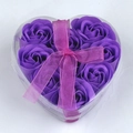 Gift box with 9 purple heart-shaped soap roses and a pink ribbon bow on white background - Purple