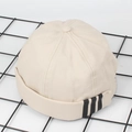 Detail van een beige canvas docker-hoed met zwarte zijstrepen op de zijkant - M(56-58cm) / Beige