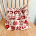 Close-up of Japanese style cotton linen drawstring bag with red cat and wave patterns - White Red Cat Head