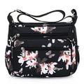 Black nylon shoulder bag with white floral print and multiple zipper pockets - 816 Magnolia