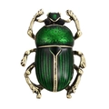 Vintage green beetle brooch with gold-plated legs and sparkling crystals on white background - Green
