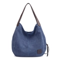 Navy blue canvas tote bag with brown leather straps and vintage saddle-shaped design - Dark Blue