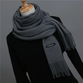 Close-up of charcoal grey cashmere scarf with soft tassels and woven logo label - 200*70cm / Deep Heather Grey