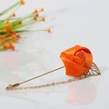 Elegant orange satin rose flower brooch with golden leaf charms and decorative chains - Orange