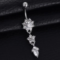 Silver flower and teardrop belly button ring with crystals on black leather background - Silver