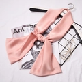 Pink silk satin skinny scarf for women tied on a hanger with minimalist accessories - Light Pink