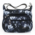 Black nylon crossbody bag for women with white floral print and multiple zip pockets - 816 Black White Floral