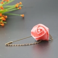 Pink satin rose lapel pin with golden metal leaf and decorative chain detail - Deep Pink