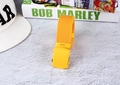 Detail of a bright yellow woven canvas belt with matching smooth painted metal buckle - Dark Yellow