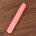 Portable pink plastic travel toothbrush case with a minimalist smiley face design - Solid Pink