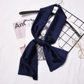Navy blue silk-like skinny scarf for women styled on a fashion magazine backdrop - Navy Blue
