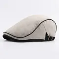 Classic cotton flat cap in oatmeal with black trim and adjustable strap for men and women - Adjustable / Beige