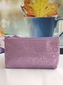 Close-up of purple fabric cosmetic bag with SOIGNE letter jacquard and zipper detail - Light Purple