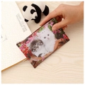 Close-up of a small square cat coin purse with zipper and metal ring on wooden table - Cat-Pattern 5