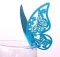 Macro view of light blue hollow paper butterfly decoration on the rim of a glass - Sky Blue