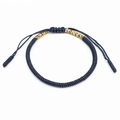 Detail of hand-woven navy blue knot bracelet with tricolor accents and adjustable cord - Multicolor and Navy Blue