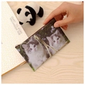 Close-up of a cute cat pattern coin purse with a silver zipper pull on a wooden desk - Cat-Pattern 8
