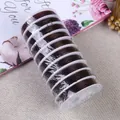 Macro detail of 10 rolls of dark brown elastic jewelry string for beaded DIY crafts - 0.6mm / Coffee