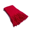 Close-up of thick vibrant red knitted scarf featuring long fringe and wool-like texture - Large / Red