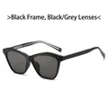 Gafas de sol de gran tamaño con montura negra, lentes gris oscuro y detalles metálicos - Montura Negra Lentes Gris Negro