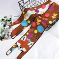 Detail of cartoon fox and gingerbread man pattern on a brown silk twilly scarf over a basket - Fox / 120cm