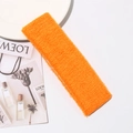 Close-up of bright orange cotton terry fabric headband with soft knitted texture - 18cm*6cm / Orange