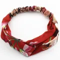 Deep red floral headband with elastic cross knot design for women made of soft fabric - Geranium Red