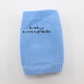 Light blue breathable cotton baby kneepads with elastic cuffs and decorative text - Blue